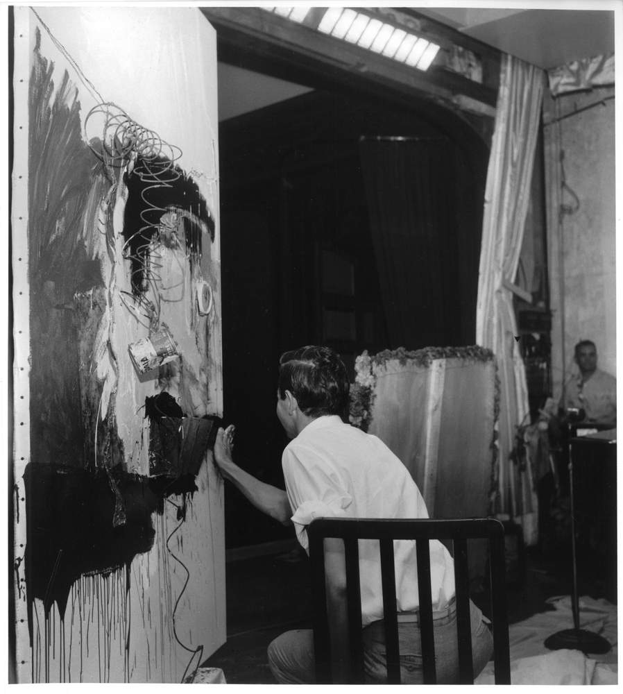 Rauschenberg creating First     Time Painting (1961) during Homage to David Tudor,     Théâtre de l’Ambassade des États-Unis, Paris, June 20, 1961. Photo:     Shunk-Kender © J. Paul Getty Trust