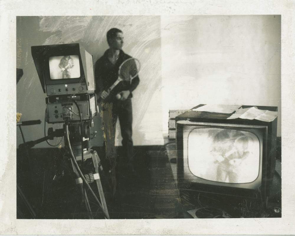 Steve Paxton with sound-wired tennis racket and infrared television system for Rauschenberg’s Open Score 1966 Photo: Robert Rauschenberg.  Steve Paxton with sound-wired tennis racket and infrared television system for Rauschenberg’s Open Score 1966 Photo: Robert Rauschenberg. 