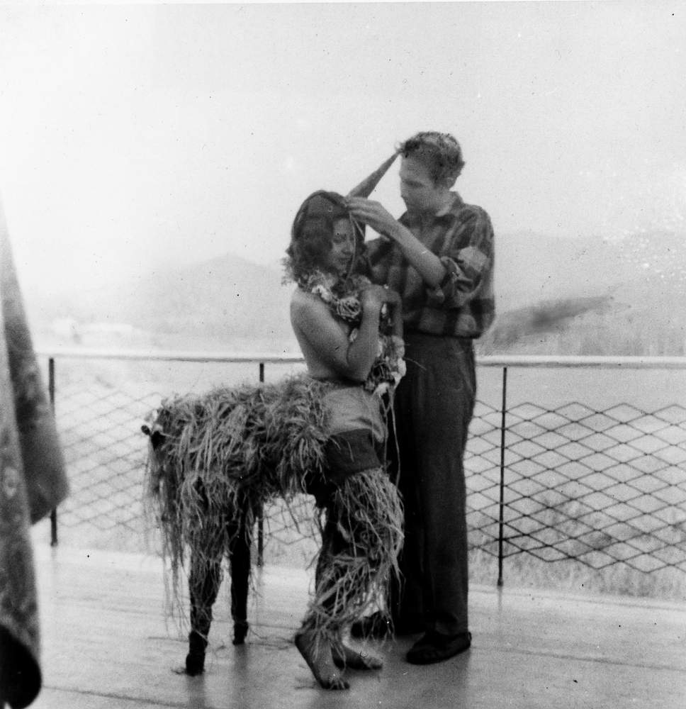 Rauschenberg designing unicorn costume for his sister Janet, for a Mardi Gras celebration, modeled by fellow student Inga Lauterstein, Black Mountain College, North Carolina, 1949. Photo: Trude Guermonprez