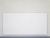 A photograph of a large white canvas hanging just off the floor in a gallery space.