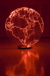 A hollow, wire globe representing the World, with the outlines of landmasses constructed in pink neon
