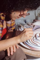 Judy Chicago working on the Georgia O'Keeffe plate for The Dinner Party, c.1976