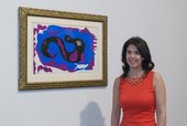 Assistant Curator Flavia Frigeri with The Dragon, in Room 2 of Henri Matisse: The Cut-Outs at Tate Modern