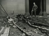 Director of the Tate Gallery John Rothenstein stands in rubble in the Tate Galleries