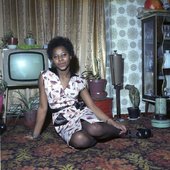 woman sitting in front of TV