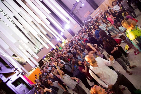 A crowd standing in the Turbine Hall at Tate Modern
