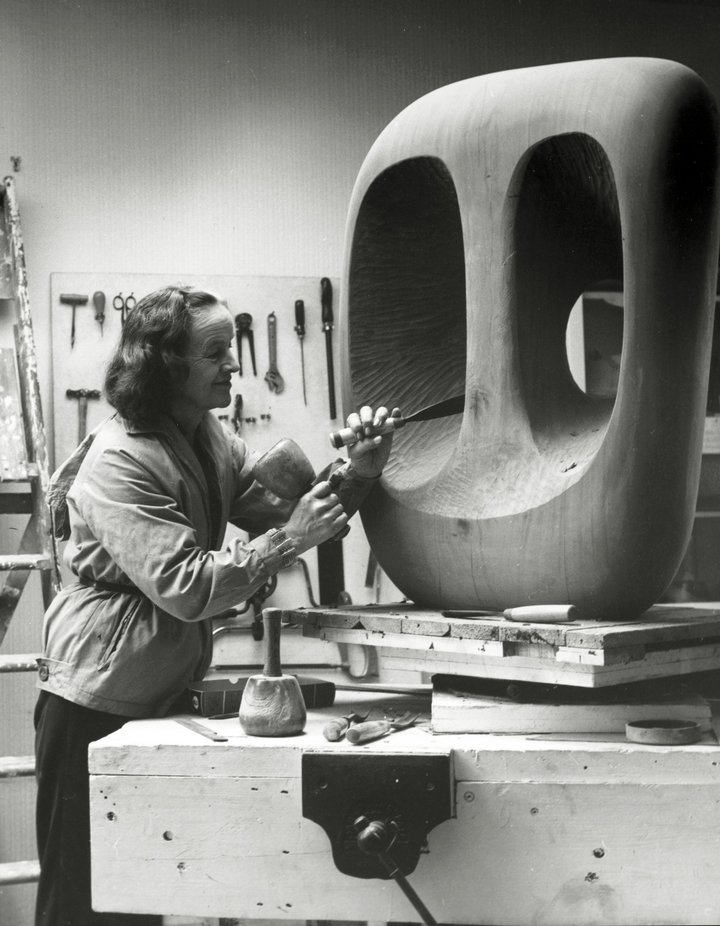 Barbara Hepworth in the Palais studio in 1963 with unfinished wood carving Hollow Form with White Interior