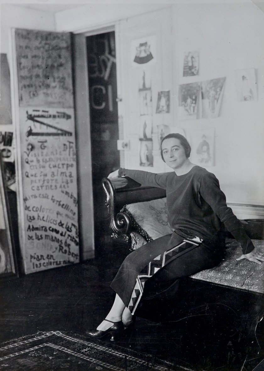 Sonia Delaunay in front of her door-poem in the Delaunay's apartment, Boulevard Malesherbes, Paris 1924 