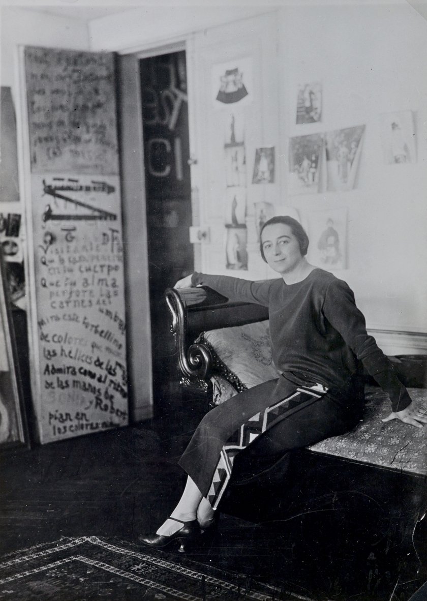 Sonia Delaunay in front of her door-poem in the Delaunay's apartment, Boulevard Malesherbes, Paris 1924
